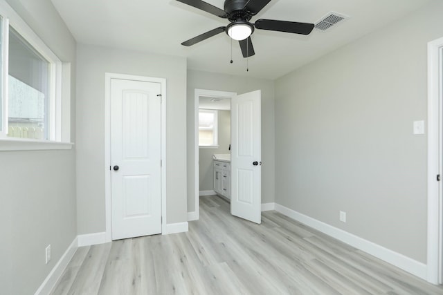 5506 Karelian Dr, Houston, TX 77091 - unfurnished bedroom featuring light wood finished floors, baseboards, and ceiling fan