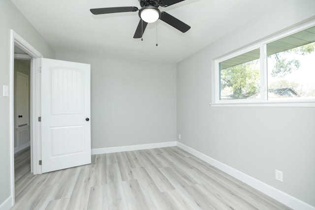 5506 Karelian Dr, Houston, TX 77091 - unfurnished bedroom with light wood-type flooring, baseboards, and ceiling fan