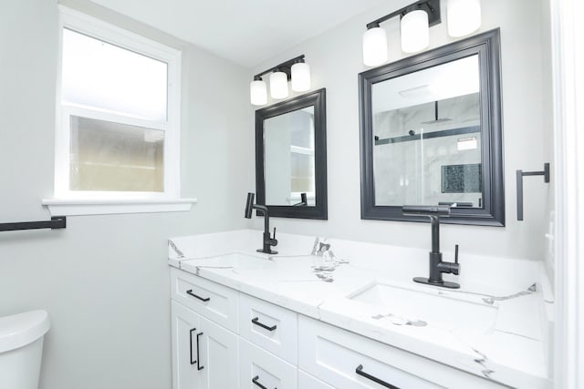 5506 Karelian Dr, Houston, TX 77091 - bathroom with a shower stall, toilet, and double vanity