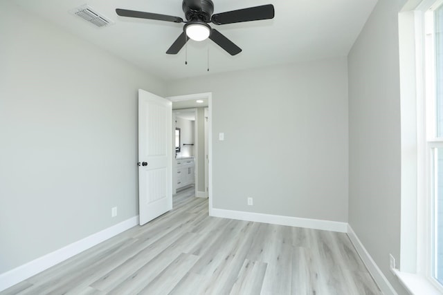 5506 Karelian Dr, Houston, TX 77091 - unfurnished bedroom with light wood-style floors, baseboards, and a ceiling fan
