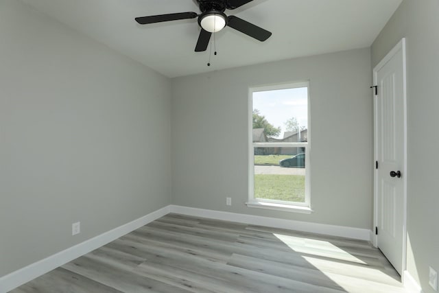 5506 Karelian Dr, Houston, TX 77091 - unfurnished room with wood finished floors, baseboards, and ceiling fan