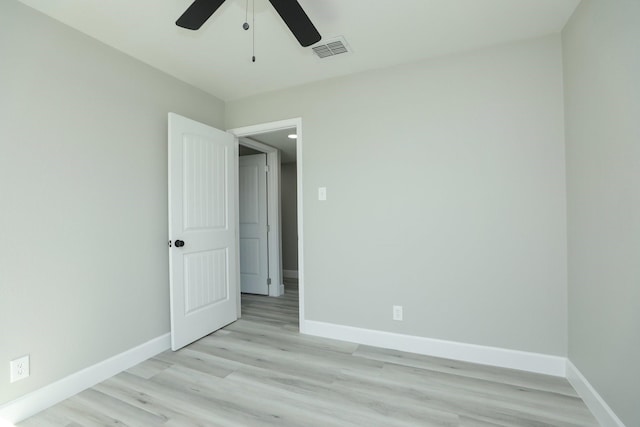 5506 Karelian Dr, Houston, TX 77091 - unfurnished bedroom with baseboards, light wood-style flooring, and a ceiling fan