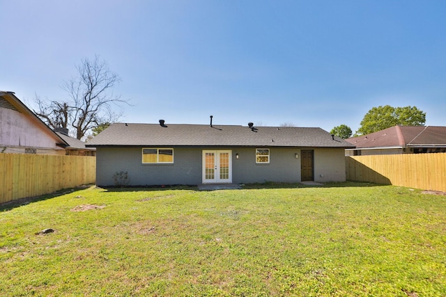 5506 Karelian Dr, Houston, TX 77091 - rear view of house with french doors, brick siding, and roof with shingles
