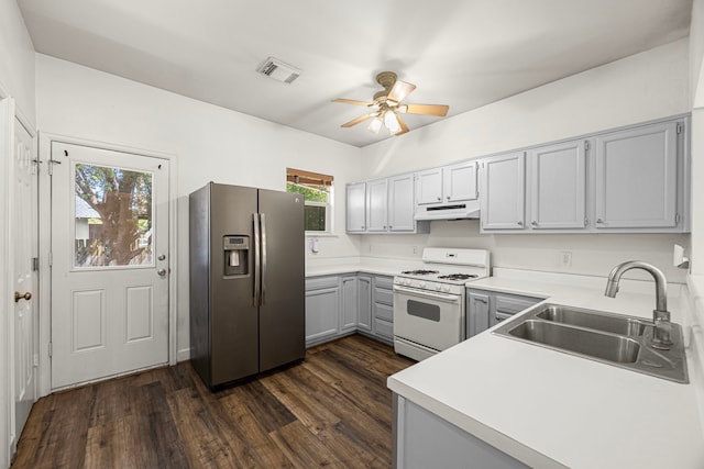 1912 Shearn St, Houston, TX 77007 - kitchen with stainless steel fridge, white gas range, under cabinet range hood, a sink, and a ceiling fan