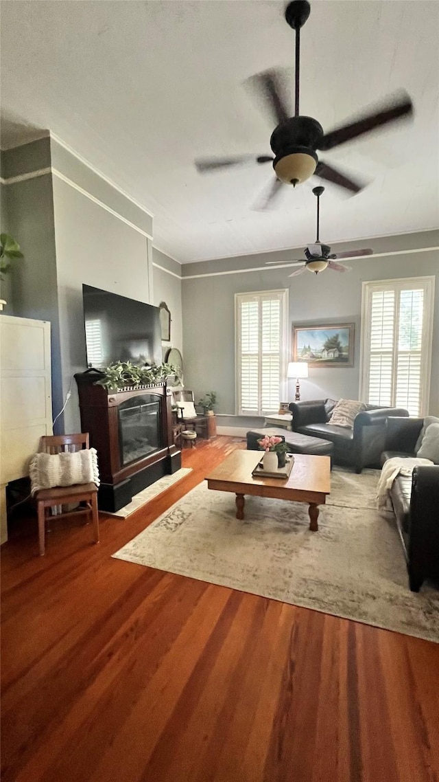 636 S Franklin, La Grange, TX 78945 - living room with wood finished floors, ceiling fan, and a glass covered fireplace