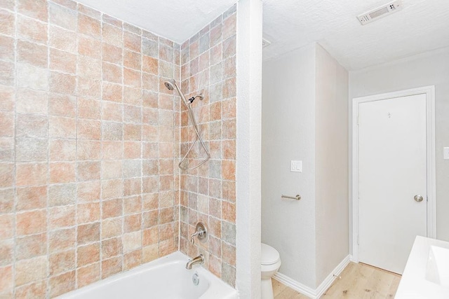 148 Seaside Ln, Texas City, TX 77590 - bathroom with shower / bathtub combination, wood finished floors, baseboards, toilet, and a sink