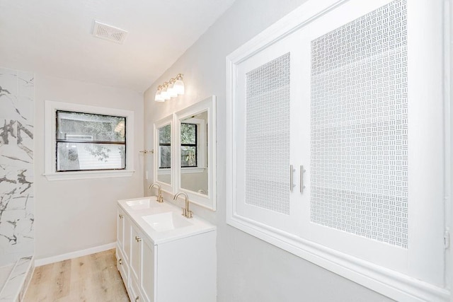 148 Seaside Ln, Texas City, TX 77590 - bathroom featuring vanity, wood finished floors, and baseboards