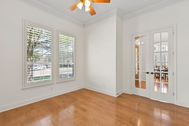 8611 Springmere Ct, Houston, TX 77095 - empty room with wood finished floors, crown molding, a ceiling fan, french doors, and baseboards