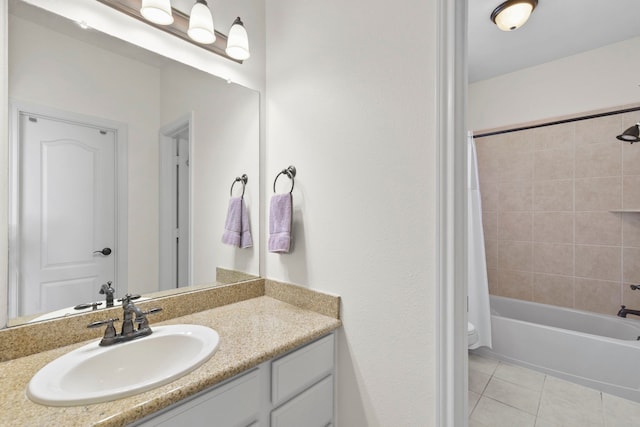 8611 Springmere Ct, Houston, TX 77095 - full bath featuring vanity, tile patterned floors, shower / bath combo, and toilet