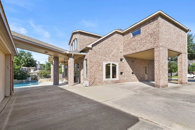 8611 Springmere Ct, Houston, TX 77095 - rear view of property featuring brick siding and a patio area