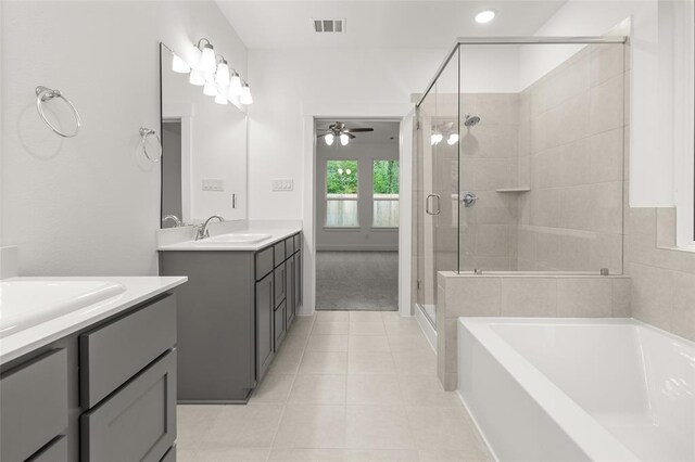 8307 Red Shiner Way, Fulshear, TX 77441 - full bathroom with a ceiling fan, two vanities, a shower stall, tile patterned flooring, and a garden tub