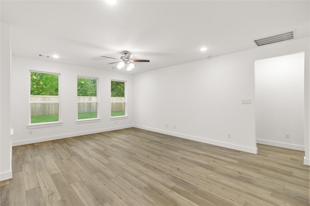 8307 Red Shiner Way, Fulshear, TX 77441 - spare room with a ceiling fan, plenty of natural light, baseboards, recessed lighting, and light wood finished floors