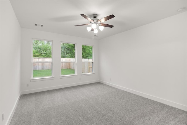 8307 Red Shiner Way, Fulshear, TX 77441 - unfurnished room featuring light carpet, baseboards, and a ceiling fan