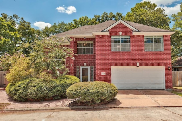 11719 Emerald Woods Dr, Houston, TX 77070 - view of front facade with driveway, a garage, fence, and brick siding
