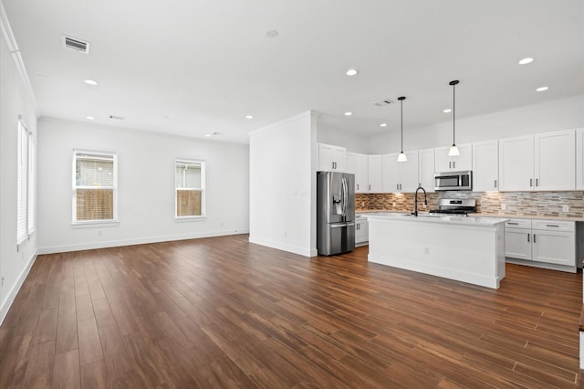 13415 Scott St, Houston, TX 77047 - kitchen featuring stainless steel appliances, a sink, open floor plan, light countertops, and tasteful backsplash
