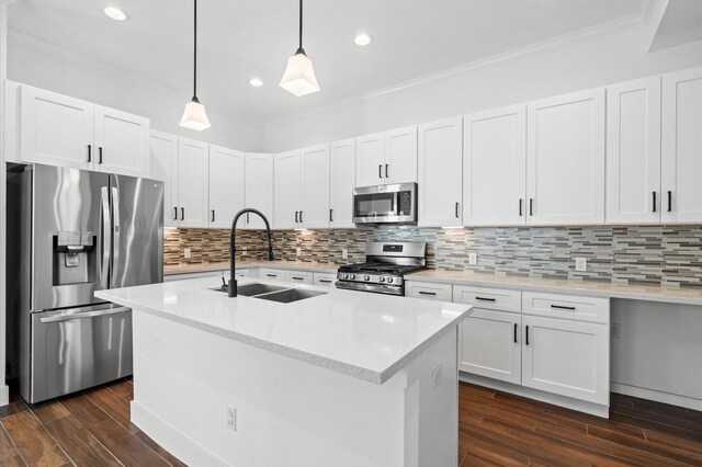 13415 Scott St, Houston, TX 77047 - kitchen with appliances with stainless steel finishes, a sink, dark wood-style floors, crown molding, and decorative light fixtures