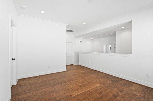 13415 Scott St, Houston, TX 77047 - spare room featuring crown molding, baseboards, recessed lighting, and wood finished floors