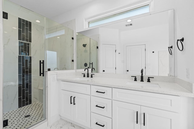 13415 Scott St, Houston, TX 77047 - bathroom with a marble finish shower, marble look tiles, and double vanity