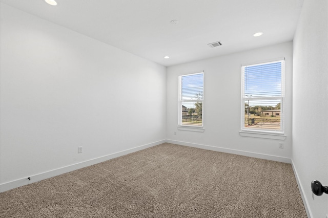 13415 Scott St, Houston, TX 77047 - unfurnished room featuring light carpet, baseboards, and recessed lighting