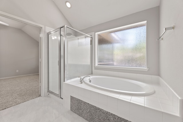 bathroom with lofted ceiling, a shower stall, a garden tub, and recessed lighting