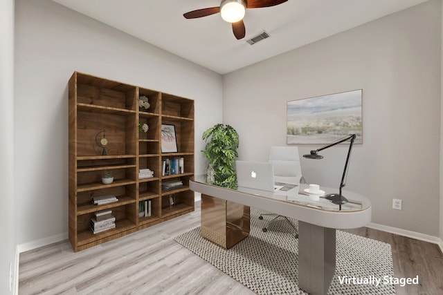 office with a ceiling fan, wood finished floors, and baseboards