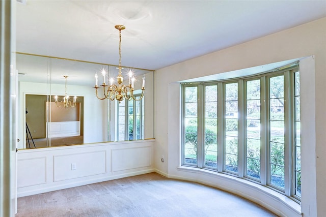 7907 Aleta Dr, Spring, TX 77379 - unfurnished dining area with a chandelier and carpet floors
