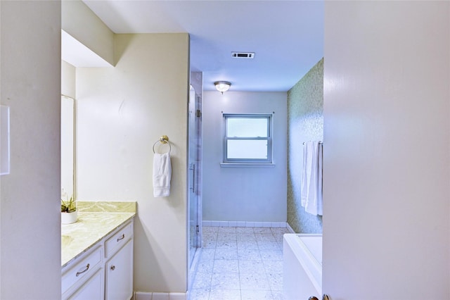7907 Aleta Dr, Spring, TX 77379 - bathroom with baseboards, tile patterned floors, vanity, and an enclosed shower