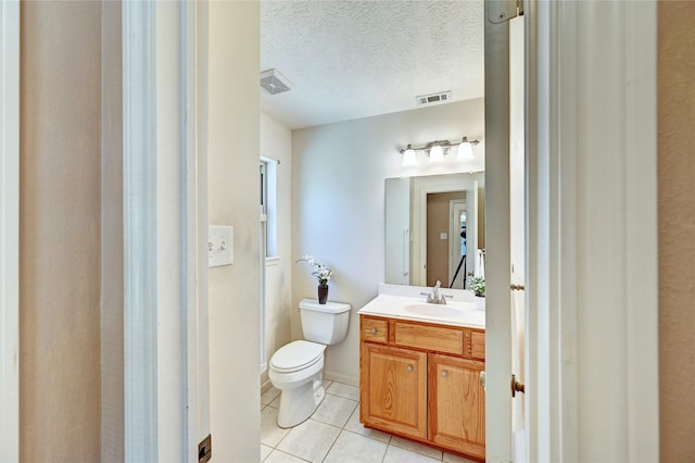 7907 Aleta Dr, Spring, TX 77379 - half bathroom featuring tile patterned flooring, toilet, and vanity