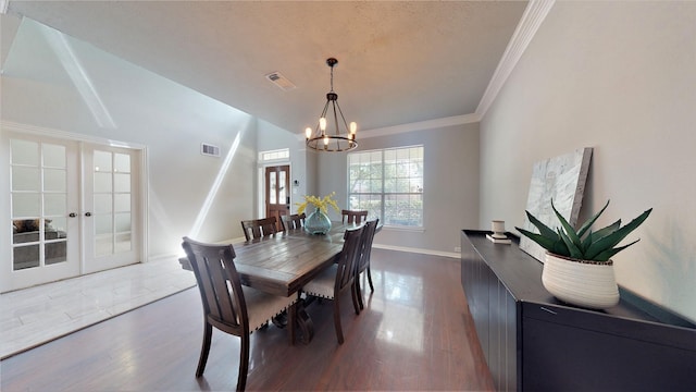 2506 Foxcrest Dr, Katy, TX 77494 - dining room featuring a chandelier, french doors, dark wood-style floors, crown molding, and baseboards