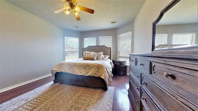 2506 Foxcrest Dr, Katy, TX 77494 - bedroom with dark wood finished floors, baseboards, and a ceiling fan