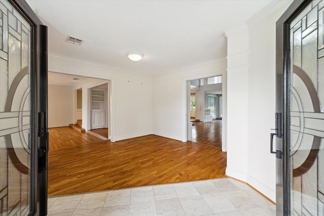14303 Bonney Brier Dr, Houston, TX 77069 - empty room with crown molding, light wood-style floors, and baseboards