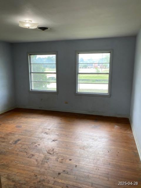 1912 18th St, Huntsville, TX 77340 - spare room featuring hardwood / wood-style floors and baseboards