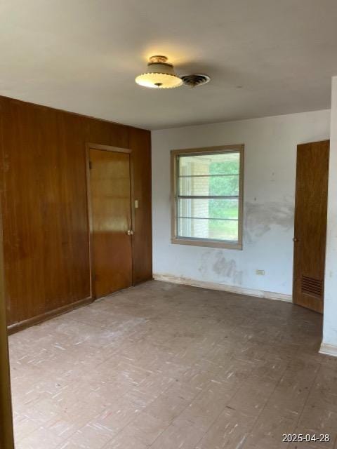 1912 18th St, Huntsville, TX 77340 - unfurnished room featuring wood walls