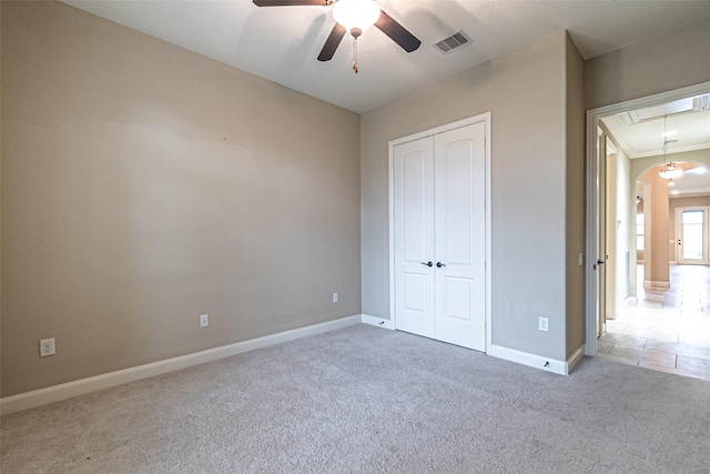 19303 Hamilton Hills Dr, Cypress, TX 77433 - unfurnished bedroom featuring attic access, carpet floors, a closet, baseboards, and arched walkways