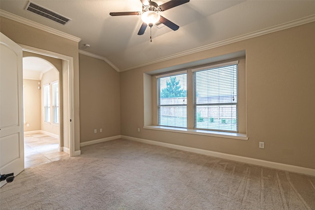 19303 Hamilton Hills Dr, Cypress, TX 77433 - empty room featuring ornamental molding, carpet flooring, plenty of natural light, arched walkways, and lofted ceiling