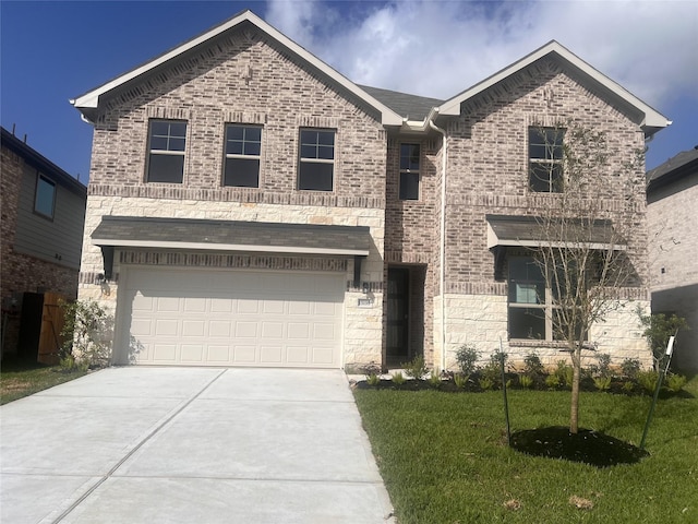 15198 Prairie Mill Dr, New Caney, TX 77357 - view of front facade with concrete driveway, a front yard, an attached garage, and brick siding