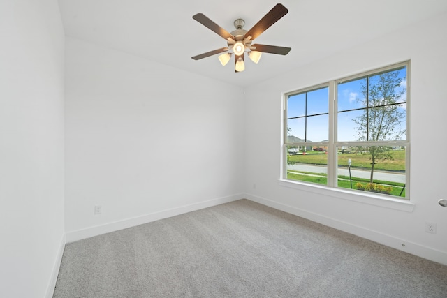 15198 Prairie Mill Dr, New Caney, TX 77357 - carpeted spare room with baseboards and a ceiling fan