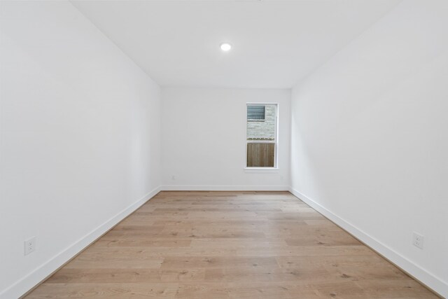 15198 Prairie Mill Dr, New Caney, TX 77357 - empty room with light wood finished floors and recessed lighting