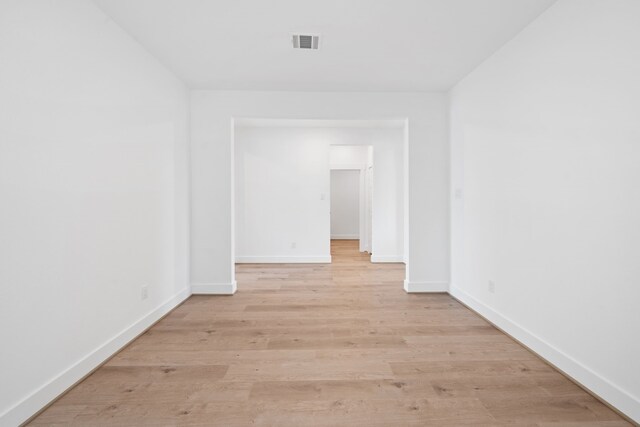 15198 Prairie Mill Dr, New Caney, TX 77357 - unfurnished room with baseboards and light wood-style flooring