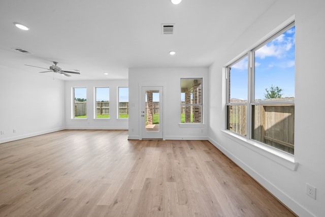 15198 Prairie Mill Dr, New Caney, TX 77357 - unfurnished living room with light wood-type flooring, recessed lighting, and ceiling fan