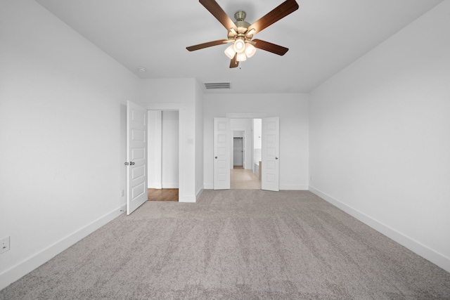 15198 Prairie Mill Dr, New Caney, TX 77357 - unfurnished bedroom with carpet, a ceiling fan, and ensuite bathroom