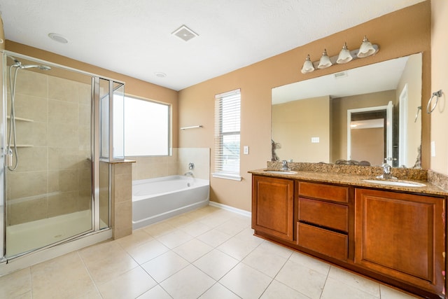 2706 Redwing Grove Way, Houston, TX 77038 - bathroom with a stall shower, tile patterned flooring, double vanity, a garden tub, and baseboards