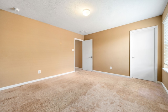unfurnished bedroom with carpet flooring and baseboards