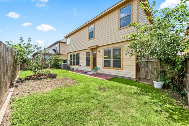 2706 Redwing Grove Way, Houston, TX 77038 - back of house with central air condition unit and a patio area