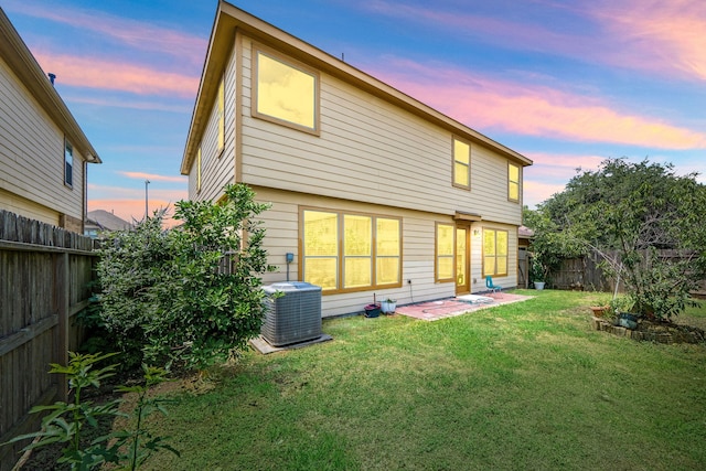 2706 Redwing Grove Way, Houston, TX 77038 - back of property at dusk featuring central air condition unit