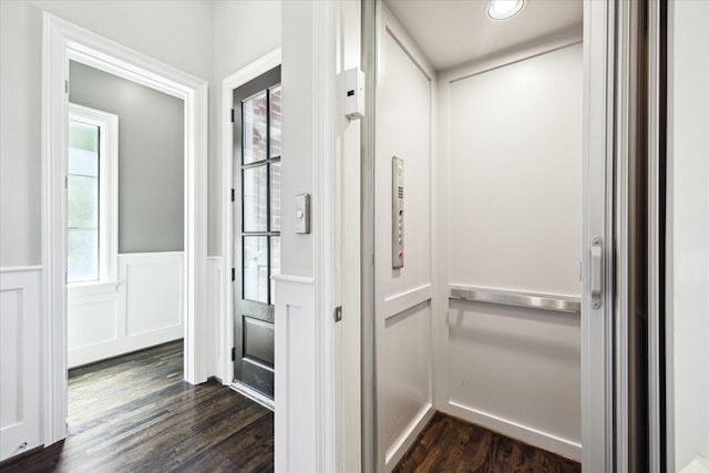 interior space featuring elevator, dark wood-style floors, wainscoting, plenty of natural light, and recessed lighting