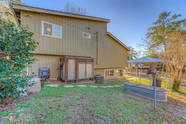 162 Ferncrest, Livingston, TX 77351 - rear view of house with central air condition unit