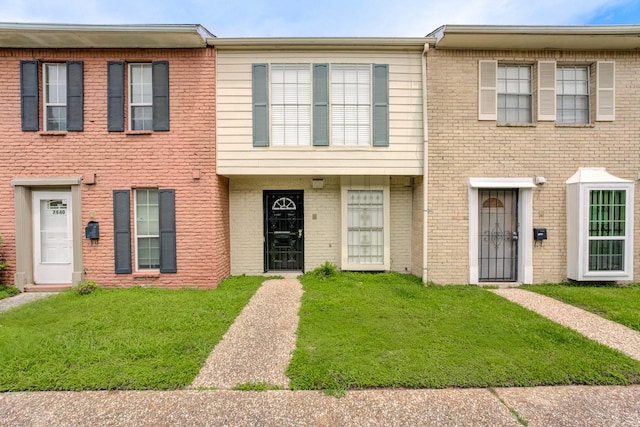 7938 Leonora St Unit B19, Houston, TX 77061 - view of property featuring a front lawn and brick siding