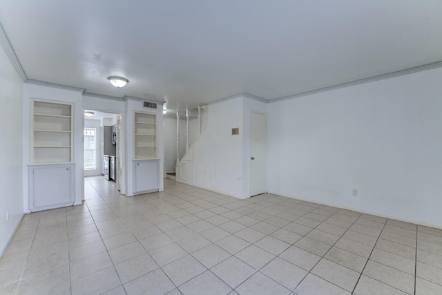 7938 Leonora St Unit B19, Houston, TX 77061 - empty room featuring built in features, light tile patterned flooring, and crown molding