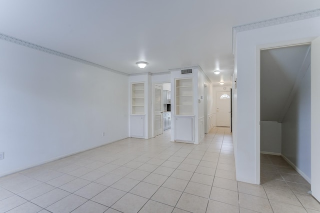 7938 Leonora St Unit B19, Houston, TX 77061 - empty room with light tile patterned floors, built in features, and baseboards